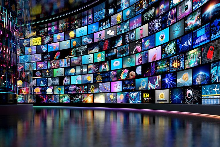 Multiple digital screens displaying diverse content representing omnichannel programmatic advertising and increased brand visibility.